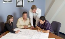 Employees Go Over Floor Plan