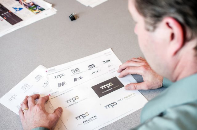 Creative Director reviewing logo design concepts