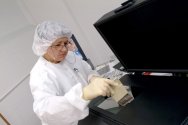 Worker Cleans Equipment Display