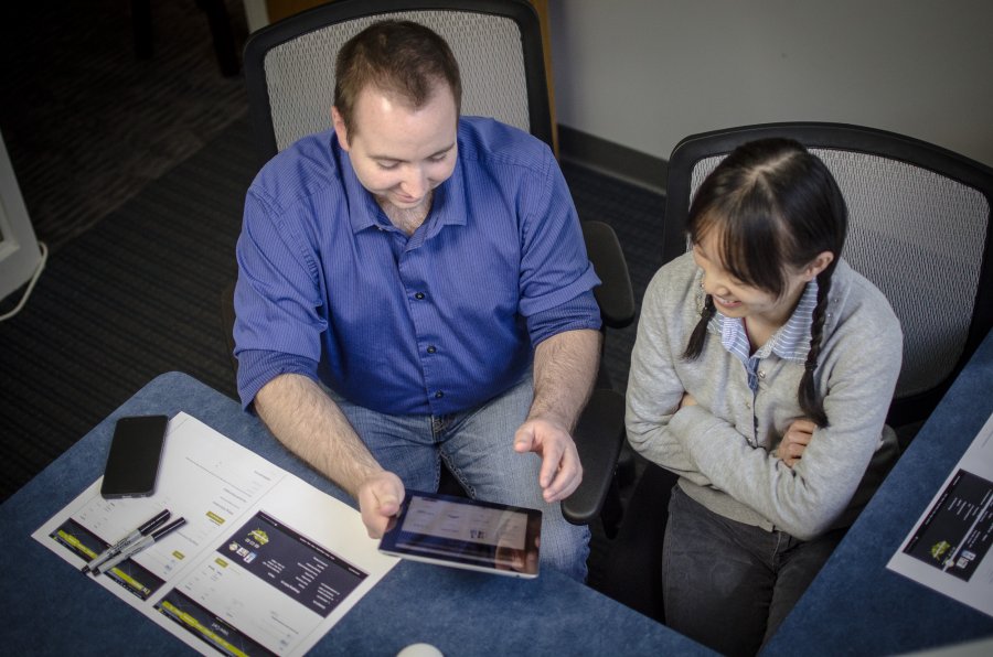 Employees Discussing Handheld Design