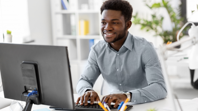 person on the computer using the new Google Analytics 4