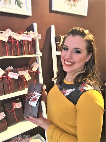 Bethany Dudek holding the Valentine's Day Chocolate Collection she designed.